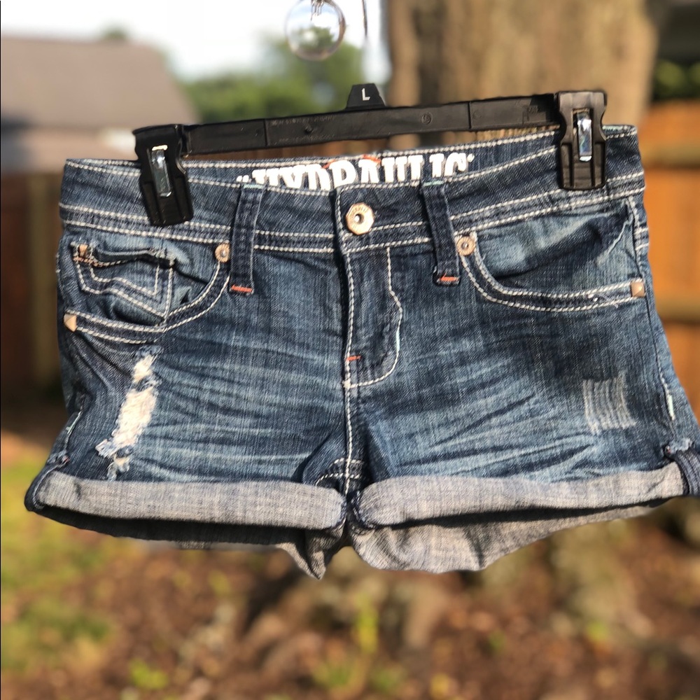 Distressed blue jean shorts
